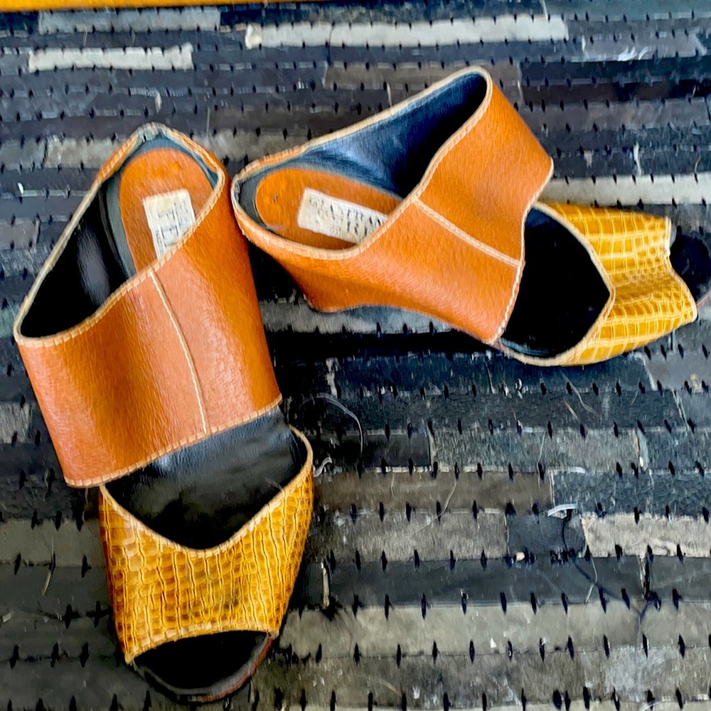 Richly textured Italian leather wedge mule.
